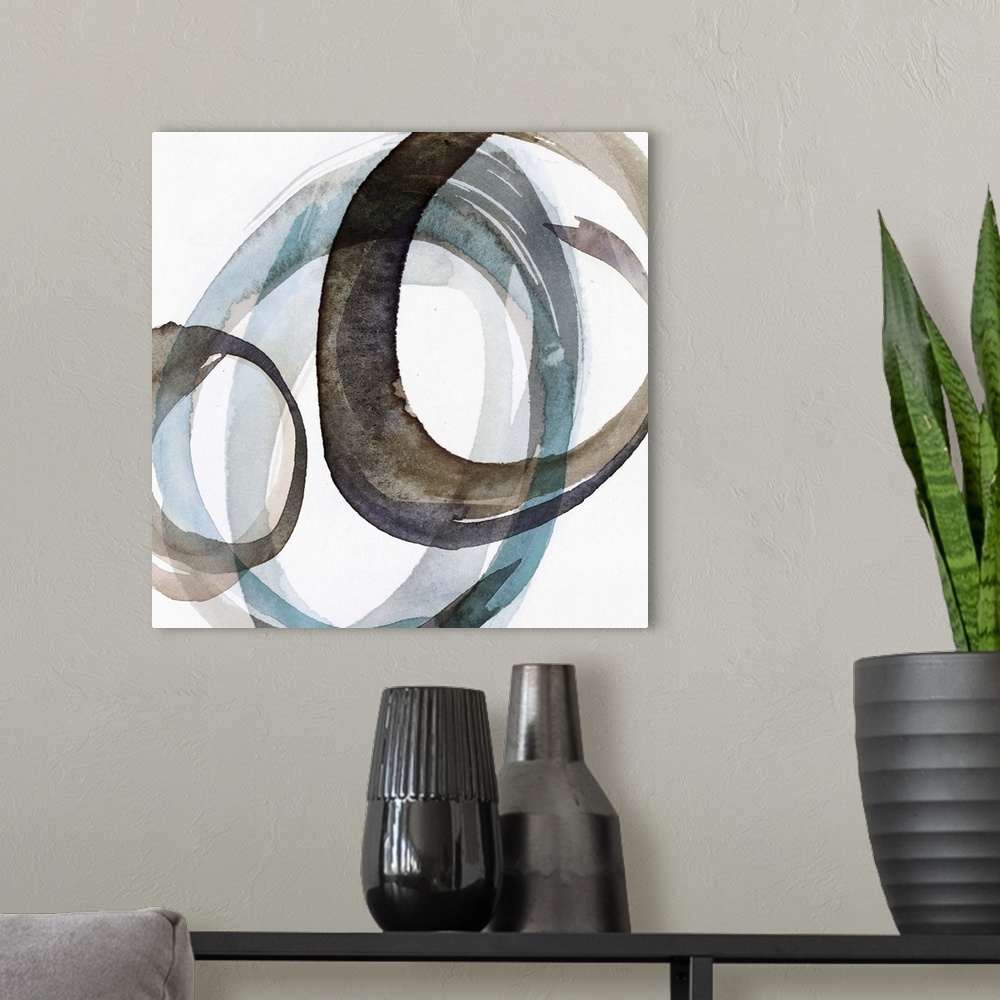 A modern room featuring Contemporary home decor artwork of a watercolor circles against a white background.