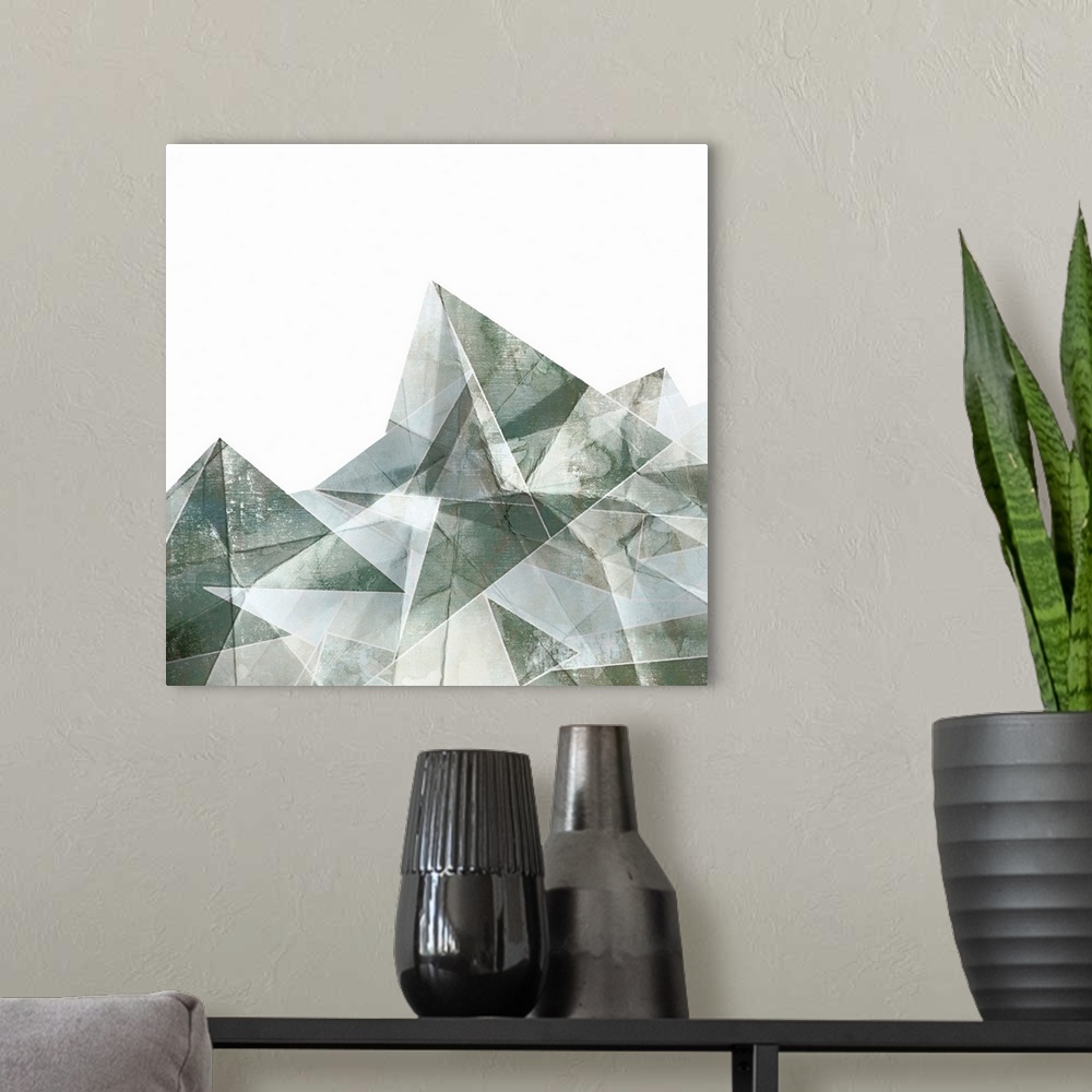 A modern room featuring Square painting of gray abstract geometric shapes.