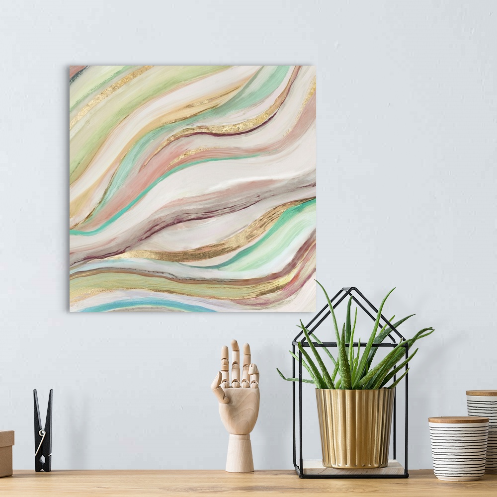 A bohemian room featuring Square painting of waved brush stroked lines in muted colors of green, pink and gold.