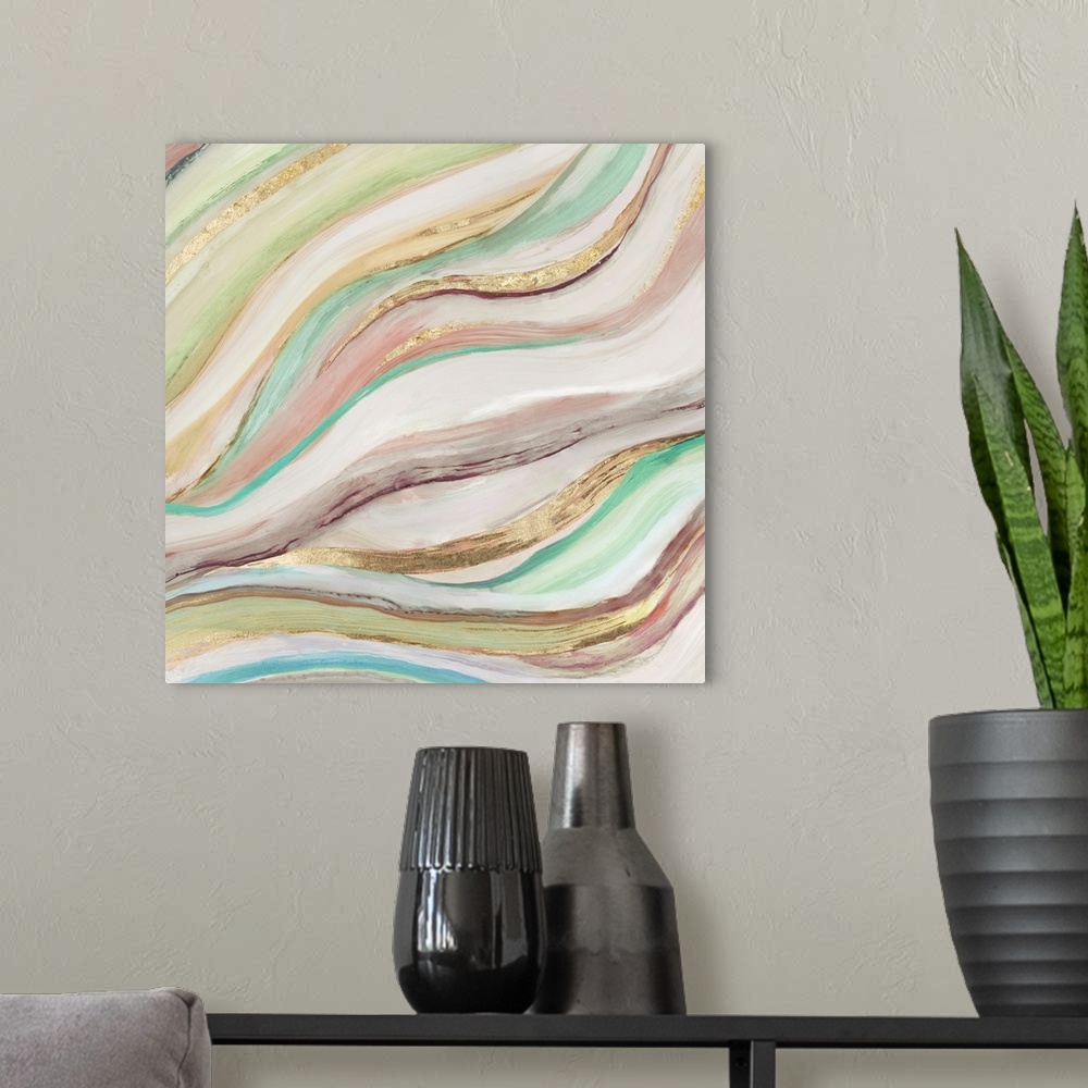 A modern room featuring Square painting of waved brush stroked lines in muted colors of green, pink and gold.