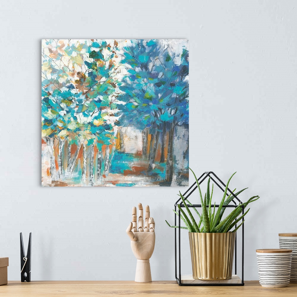 A bohemian room featuring Contemporary artwork of rows of trees with textured leaves in colors of green, blue and yellow wi...