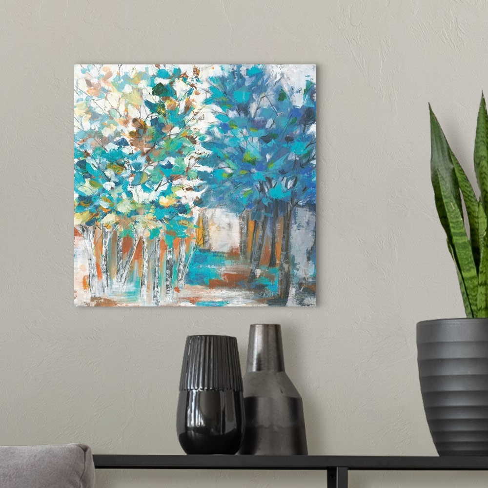 A modern room featuring Contemporary artwork of rows of trees with textured leaves in colors of green, blue and yellow wi...