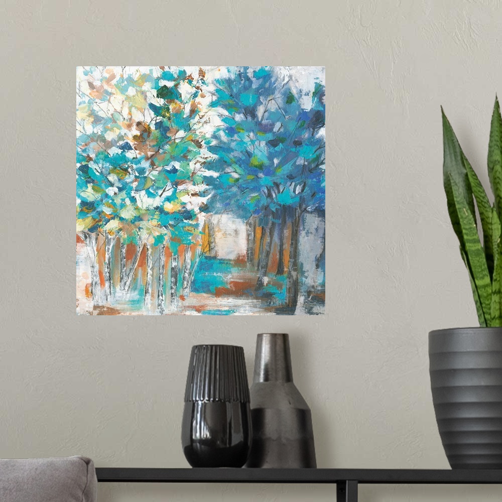 A modern room featuring Contemporary artwork of rows of trees with textured leaves in colors of green, blue and yellow wi...