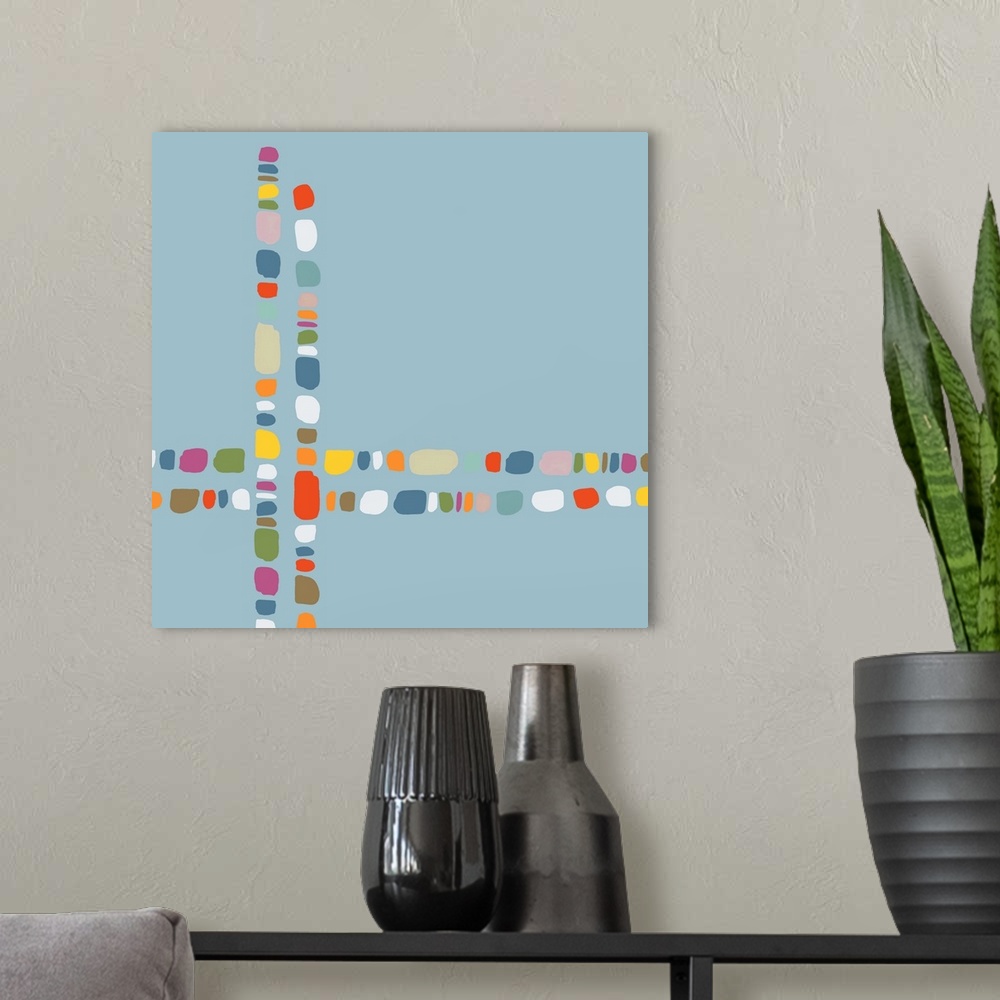 A modern room featuring Square contemporary painting of multi-colored lines crossing in a pattern.