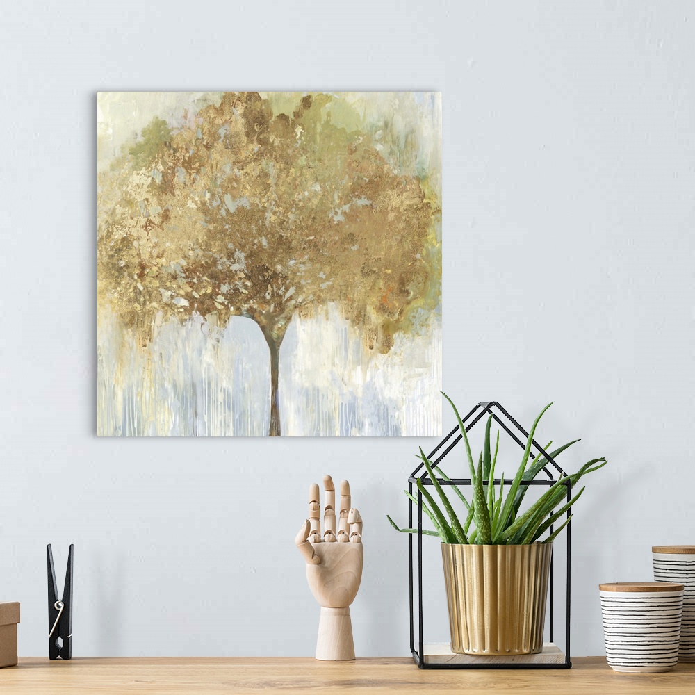 A bohemian room featuring An abstract painting of a single tree with gold accents in the leaves