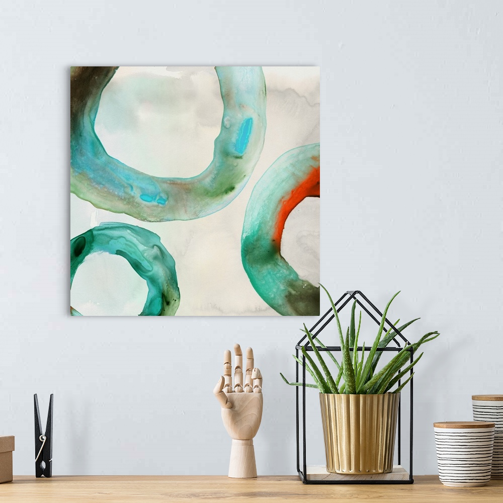 A bohemian room featuring Abstract artwork with watercolor rings in teal.