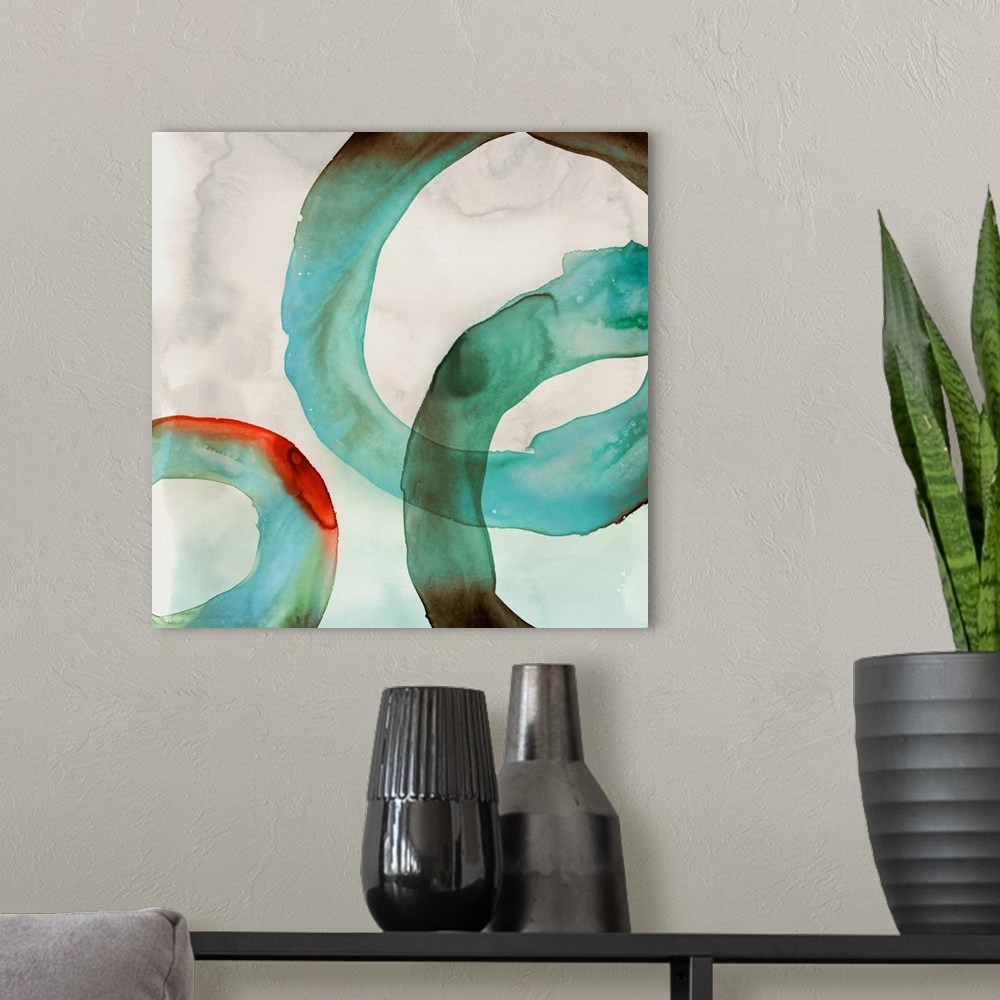A modern room featuring Abstract artwork with watercolor rings in teal.