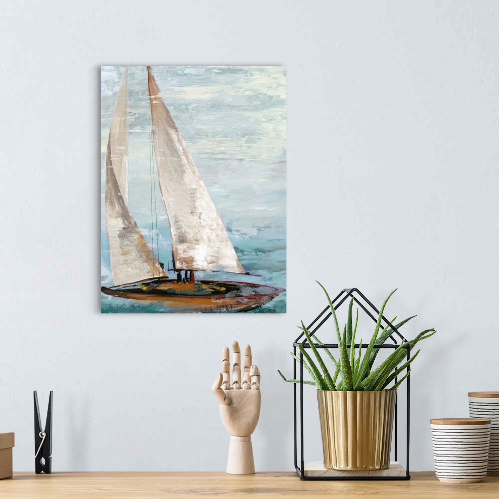 A bohemian room featuring Painting of a sailboat with full white sails.