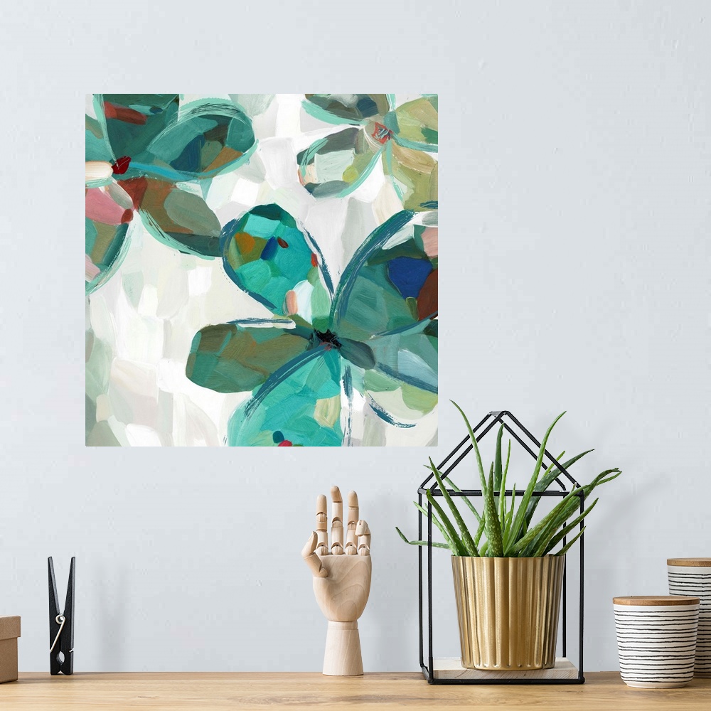 A bohemian room featuring Contemporary artwork of teal flowers with large round petals.