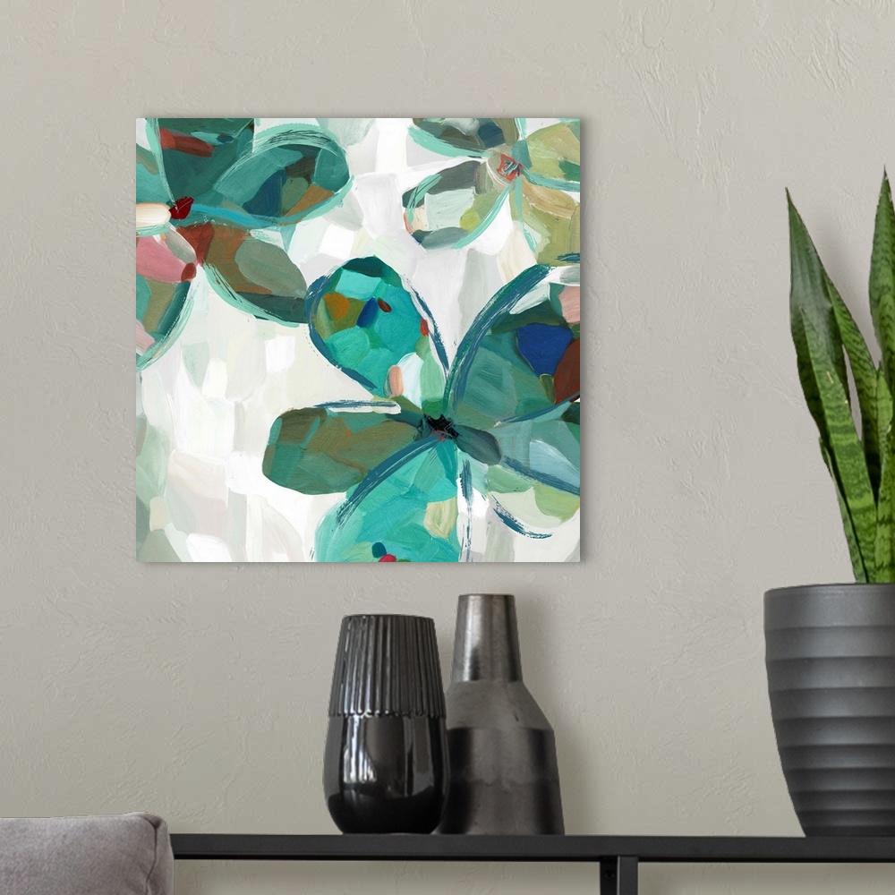 A modern room featuring Contemporary artwork of teal flowers with large round petals.