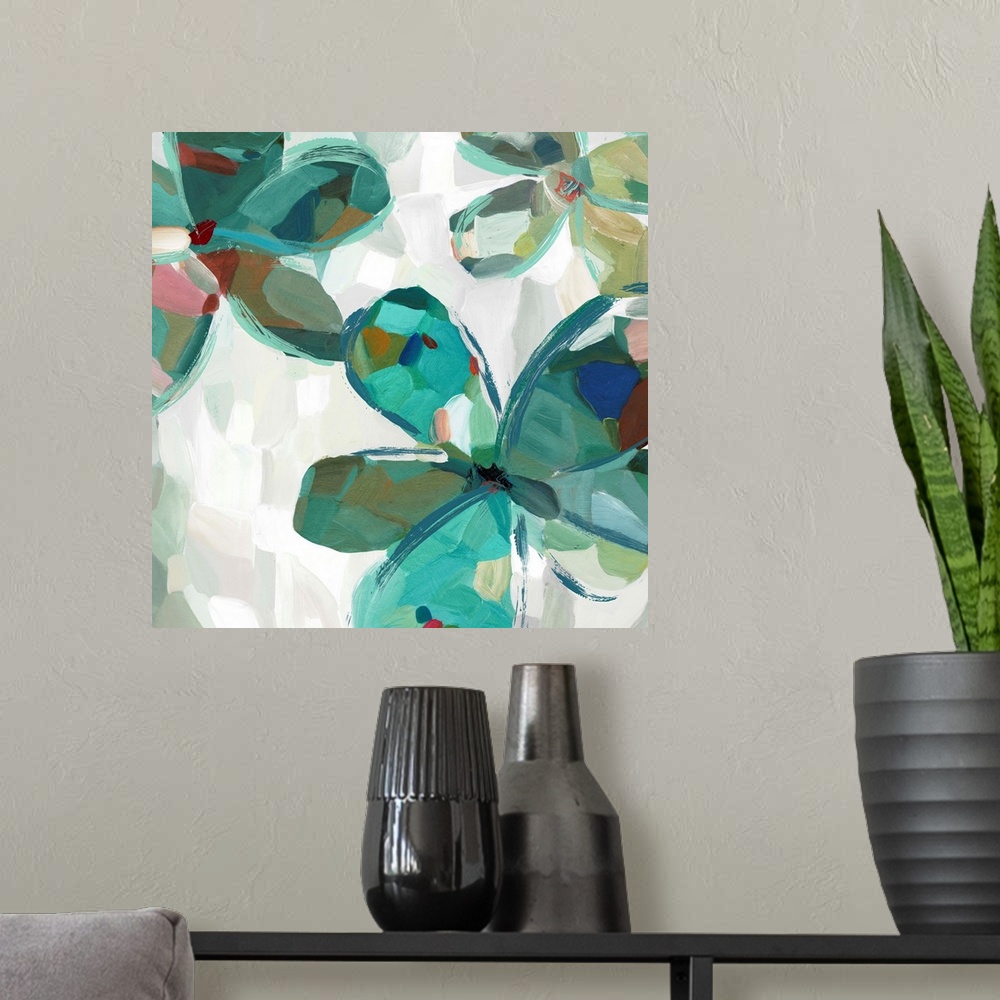 A modern room featuring Contemporary artwork of teal flowers with large round petals.