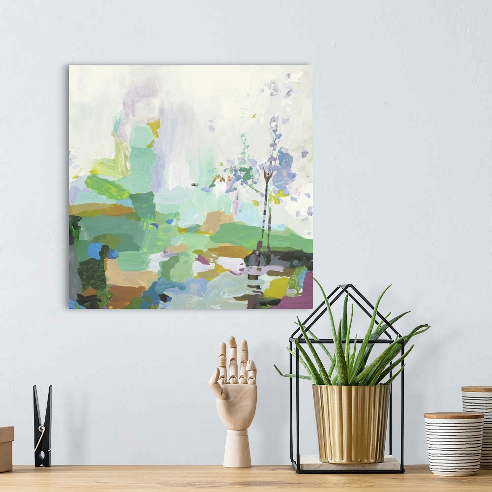 A bohemian room featuring Square abstract landscape with a tree in pastel colors.
