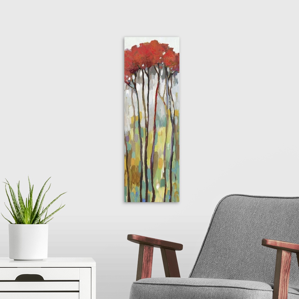 A modern room featuring Large panel painting with tall, skinny trees with red leaves on an abstract background.