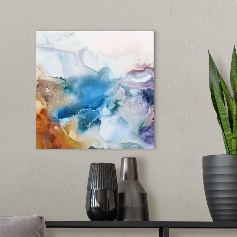 A modern room featuring Abstract watercolor artwork of softly blending shades of blue, lavender, and orange.