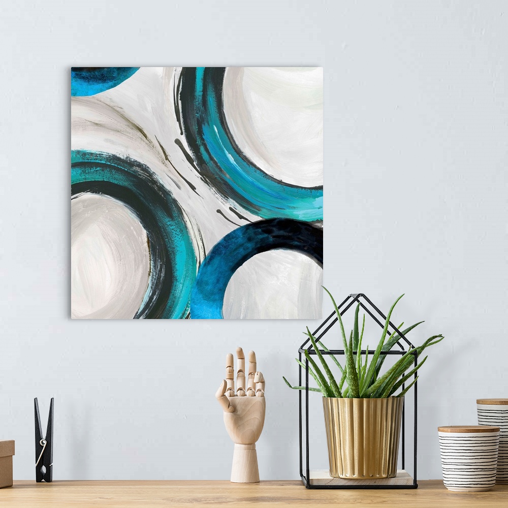 A bohemian room featuring Abstract artwork with wide turquoise rings on white.