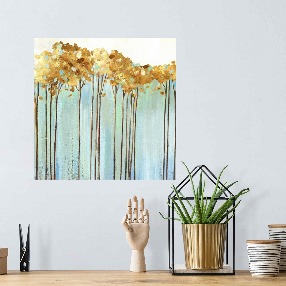 A bohemian room featuring Contemporary painting of a row of slender trees with golden leaves over pale blue and cream.