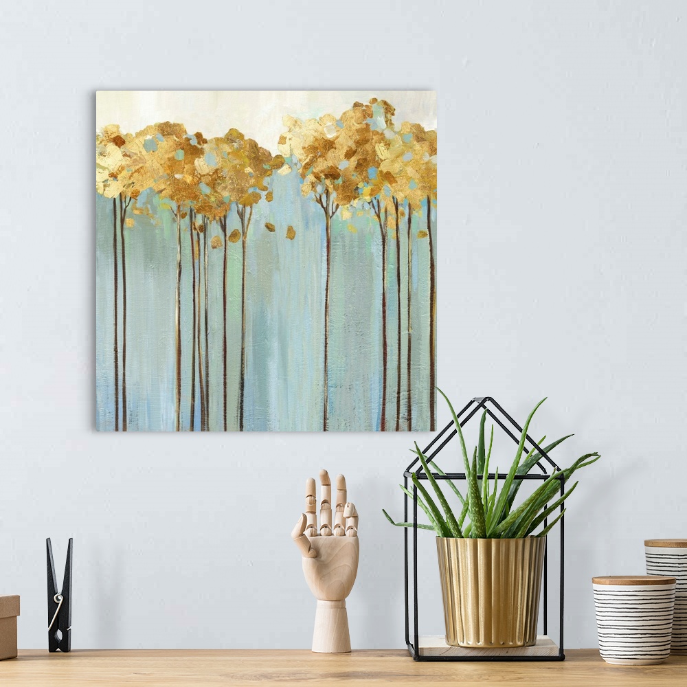 A bohemian room featuring Contemporary painting of a row of slender trees with golden leaves over pale blue and cream.