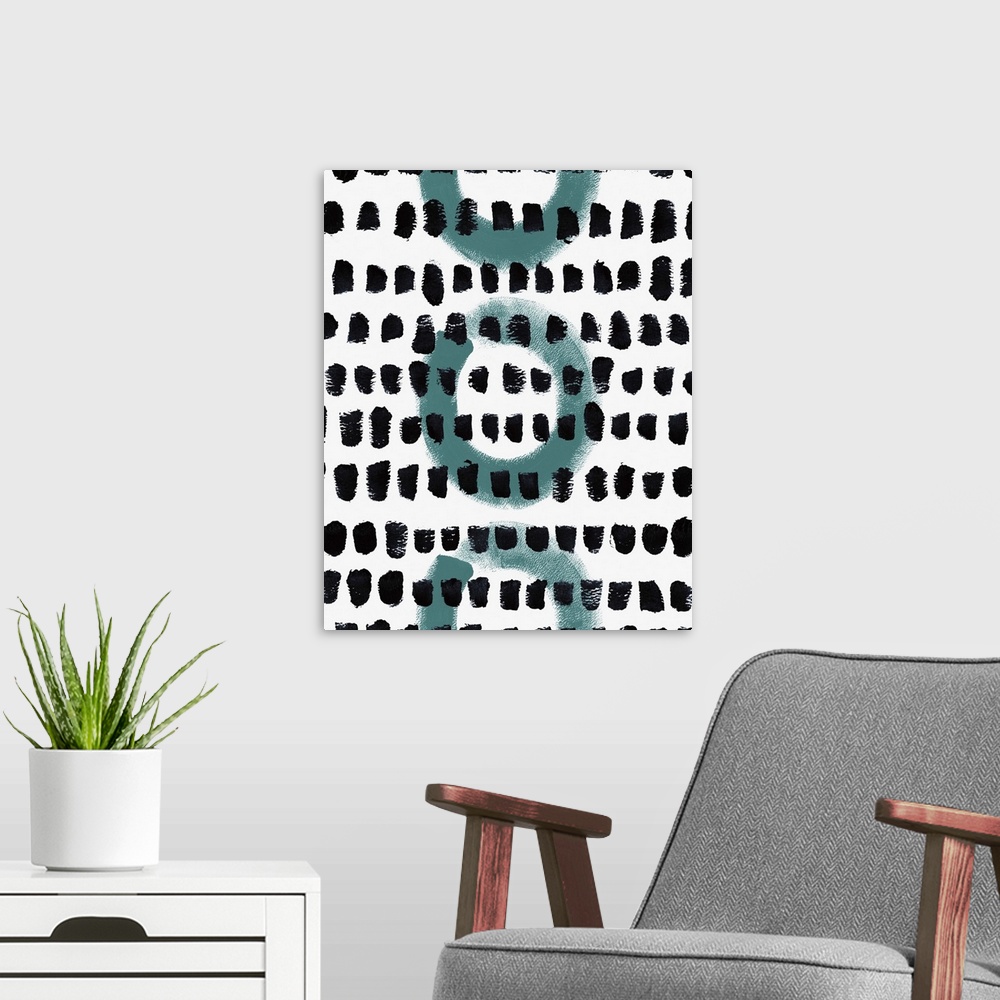 A modern room featuring Abstract painting of circles and textured dots in a pattern.