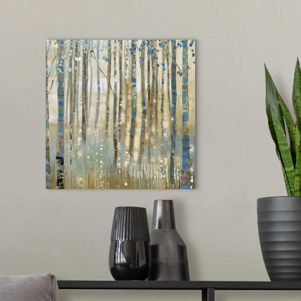 A modern room featuring Contemporary home decor artwork of a golden forest with blue accented trees.