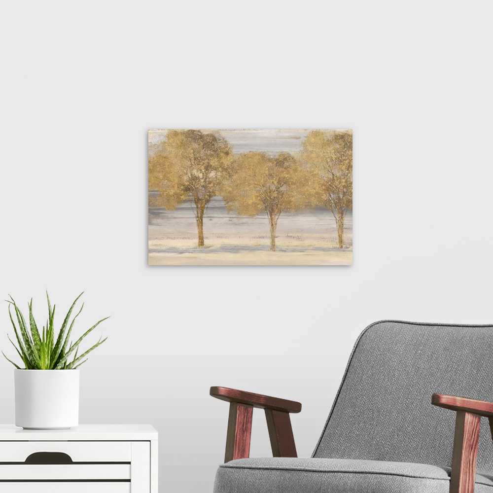 A modern room featuring Horizontal painting of a group of trees done in textured gold.