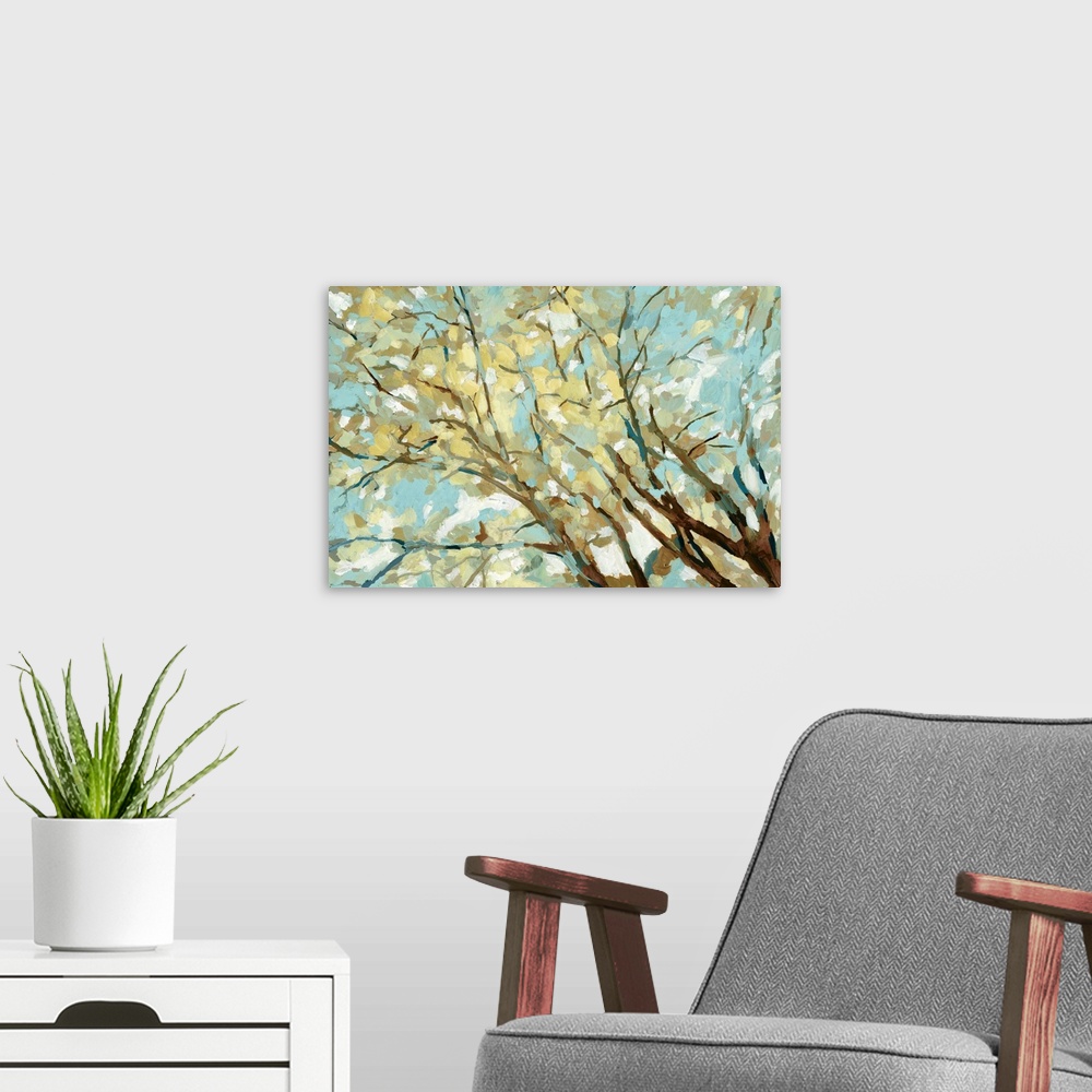 A modern room featuring Contemporary painting of branches with yellow and blue leaves.