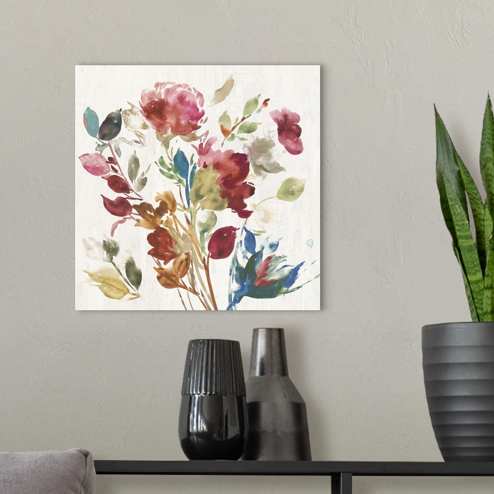 A modern room featuring Watercolor artwork of pink, green, and blue flowers over a cream colored background.