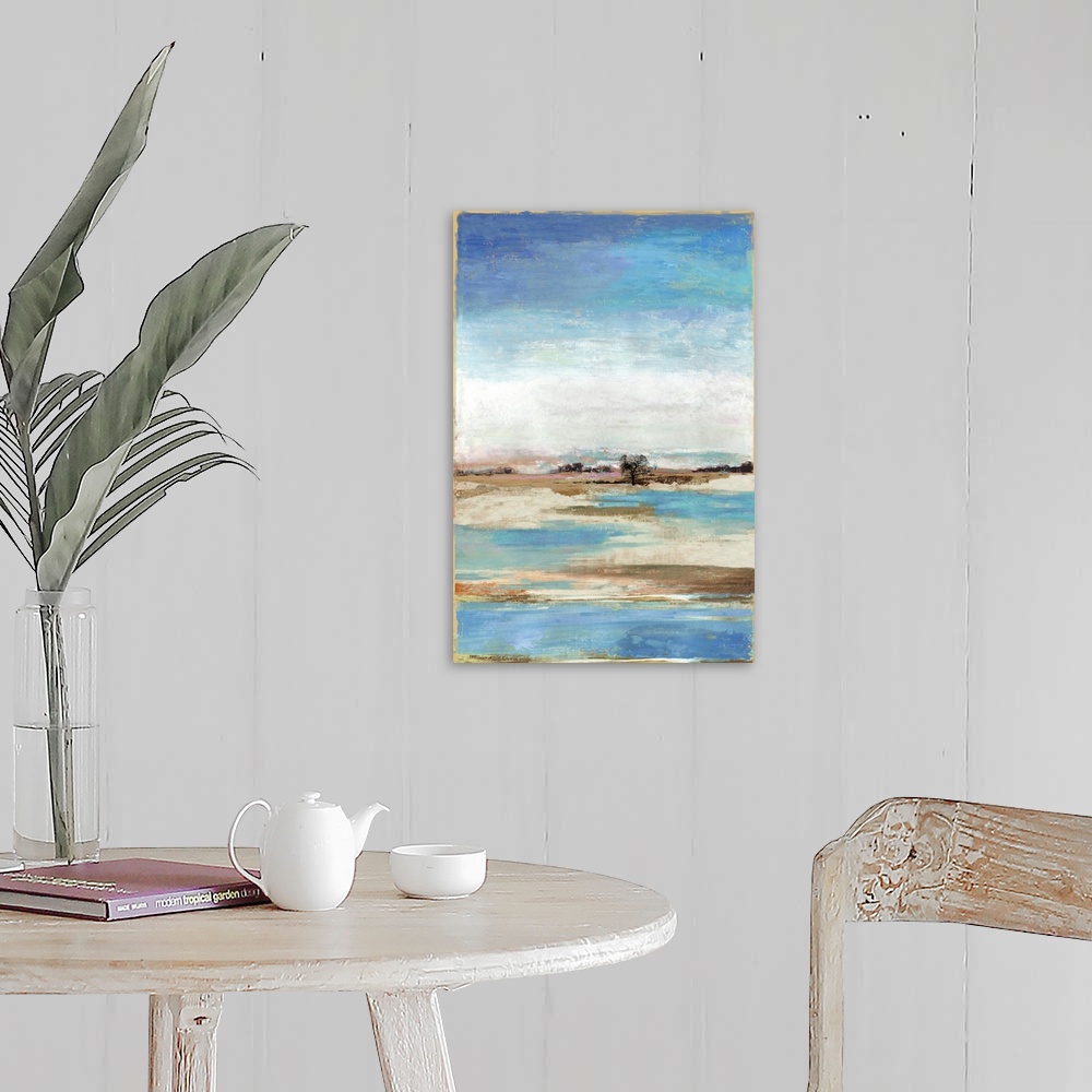 A farmhouse room featuring Vertical artwork of an abstract landscape about a waterfront with blue skies.