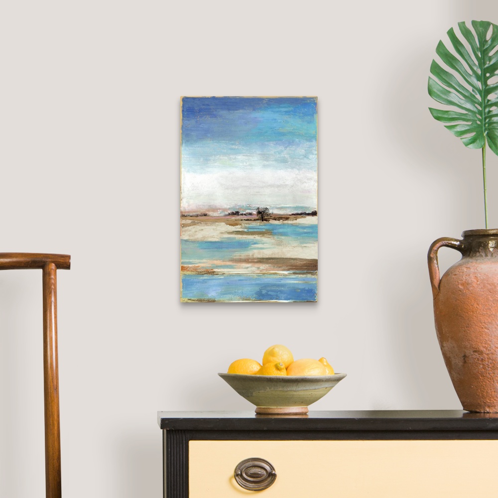 A traditional room featuring Vertical artwork of an abstract landscape about a waterfront with blue skies.