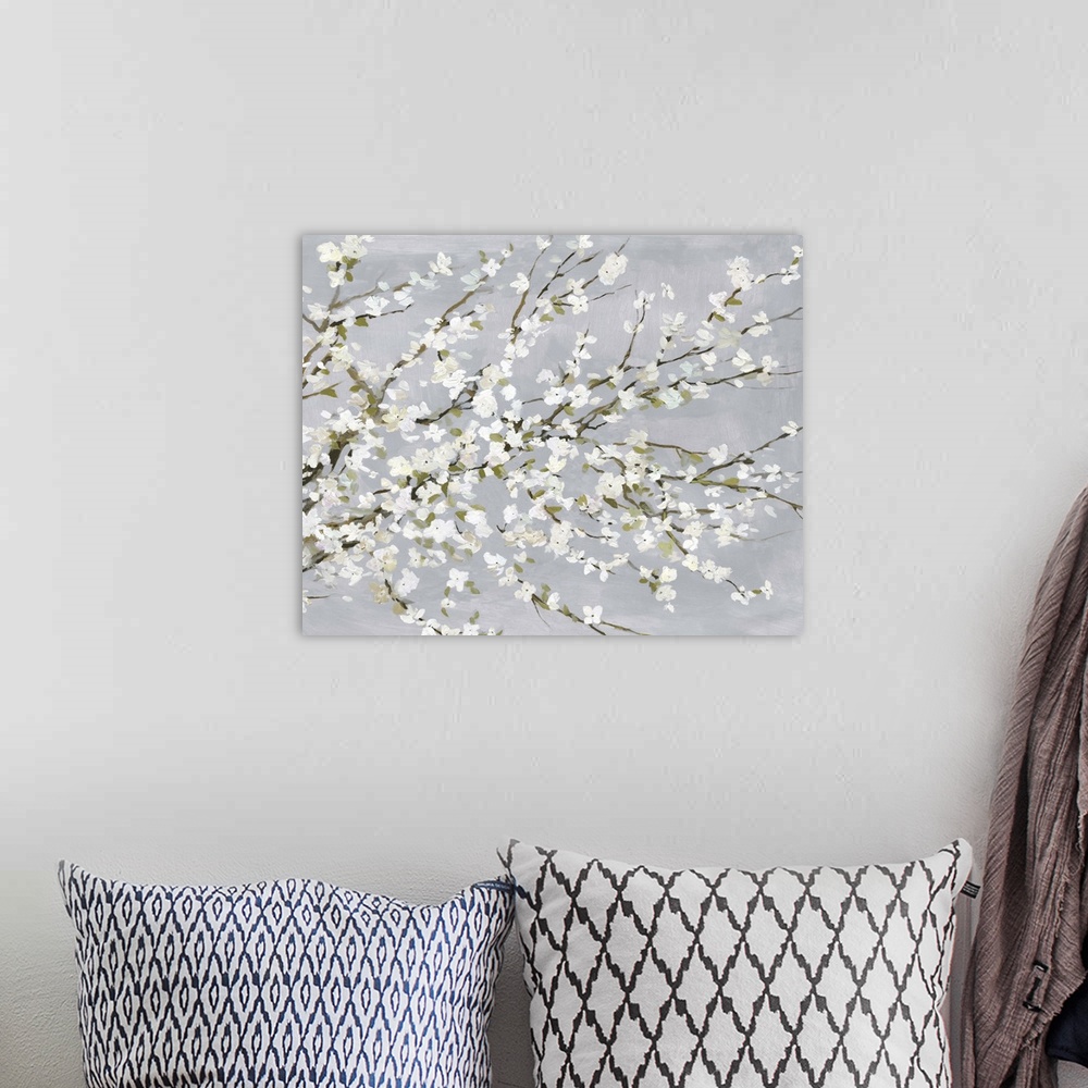 A bohemian room featuring Contemporary painting of white floral blossoms on a gray background.