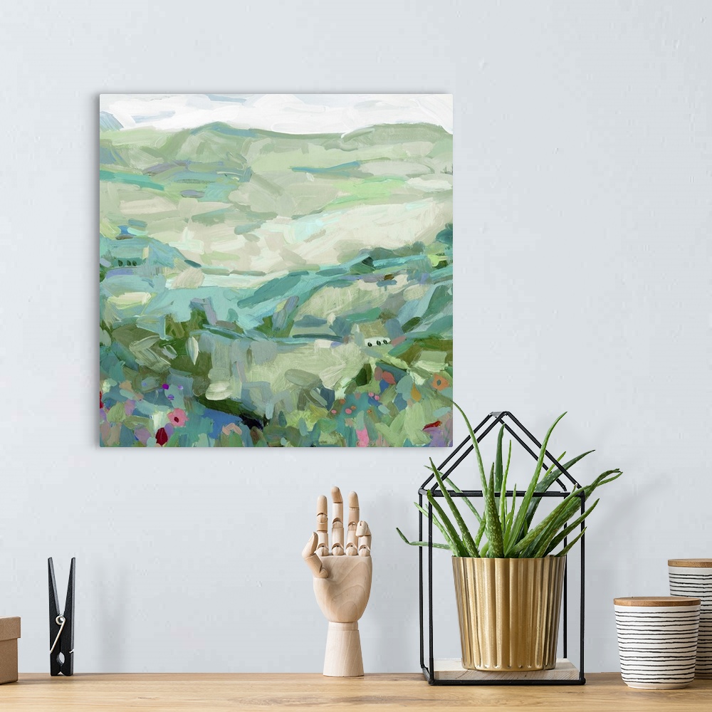 A bohemian room featuring Contemporary landscape painting of a hillside with wildflowers.
