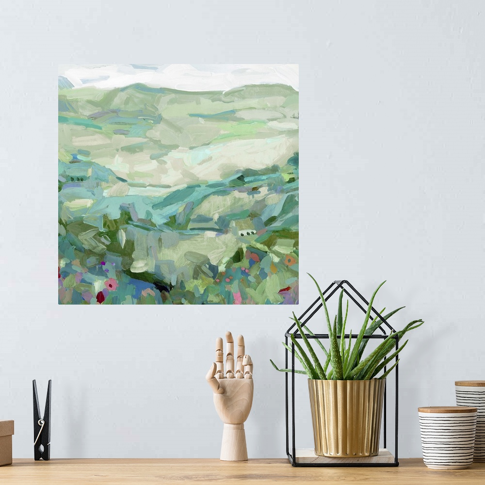 A bohemian room featuring Contemporary landscape painting of a hillside with wildflowers.