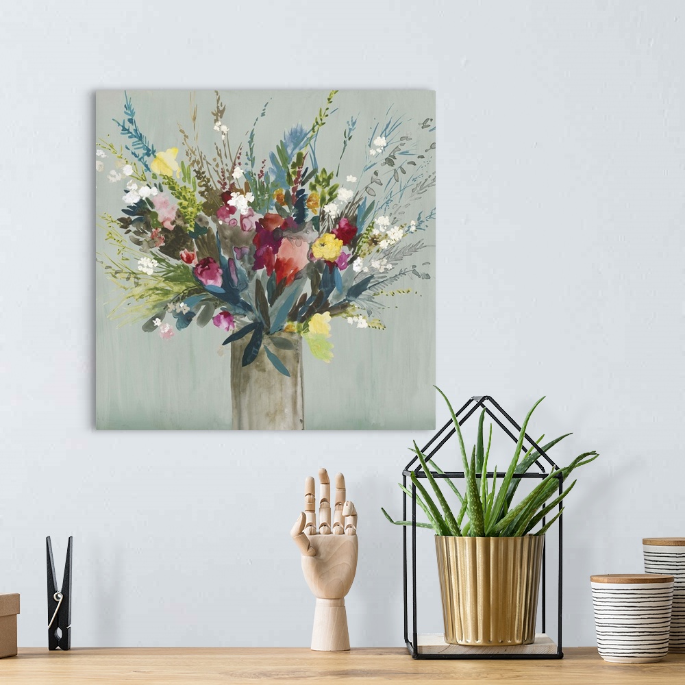 A bohemian room featuring Contemporary artwork of a vase of brilliantly colored flowers and leaves.