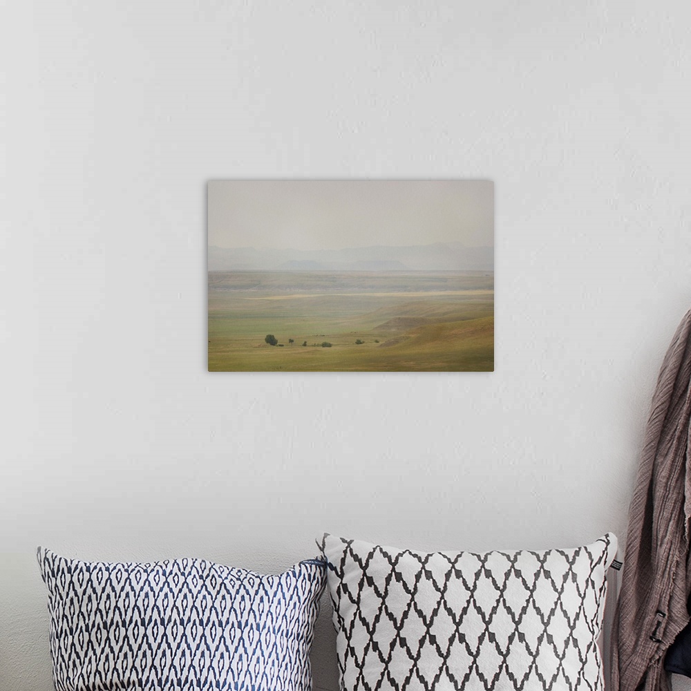 A bohemian room featuring A pictorialist landscape photograph of a western prairie landscape of Montana, USA. Farms up agai...