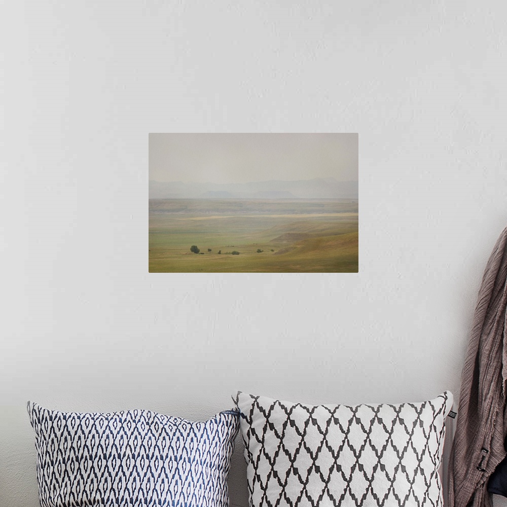 A bohemian room featuring A pictorialist landscape photograph of a western prairie landscape of Montana, USA. Farms up agai...