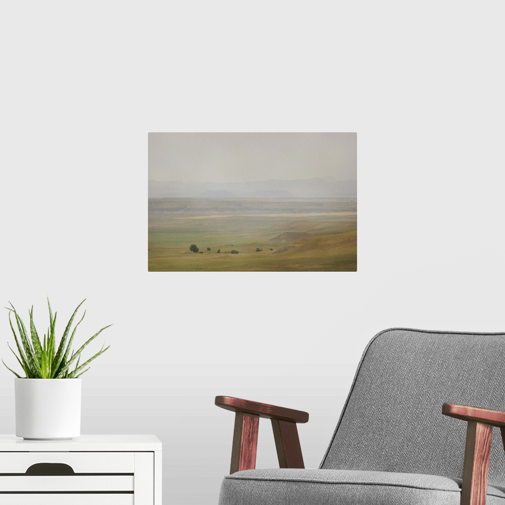 A modern room featuring A pictorialist landscape photograph of a western prairie landscape of Montana, USA. Farms up agai...