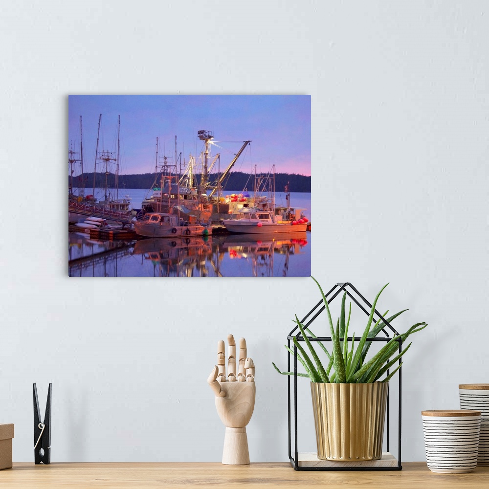 A bohemian room featuring Pictorialist photo of fishing boats reflected in the water while docked.
