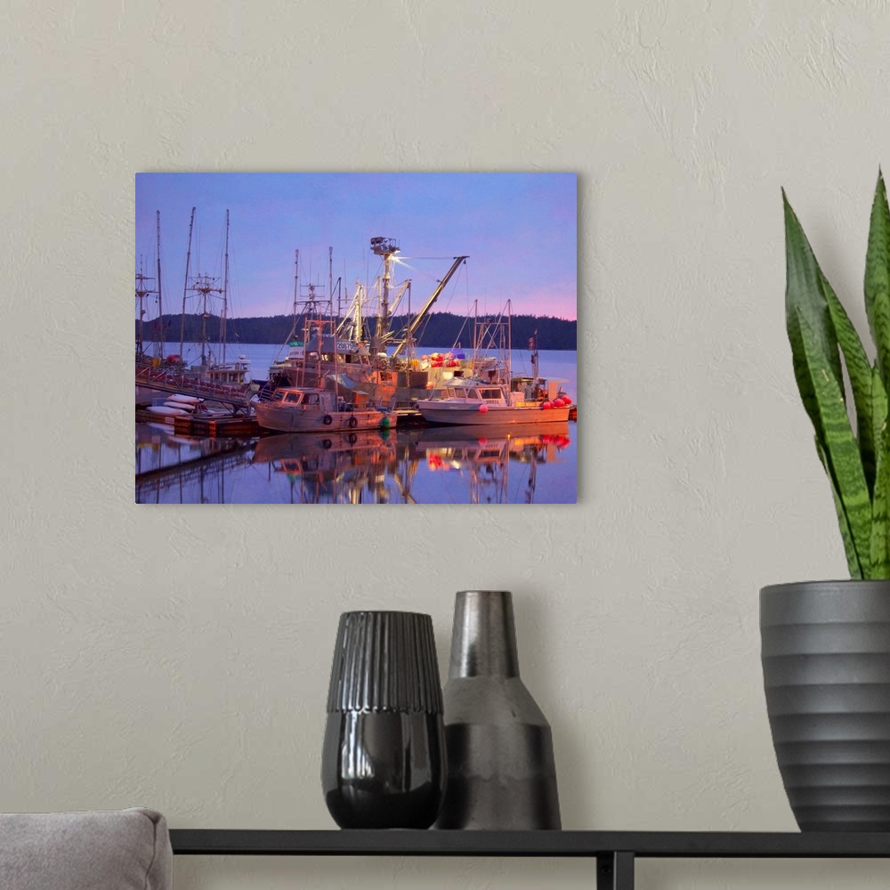 A modern room featuring Pictorialist photo of fishing boats reflected in the water while docked.