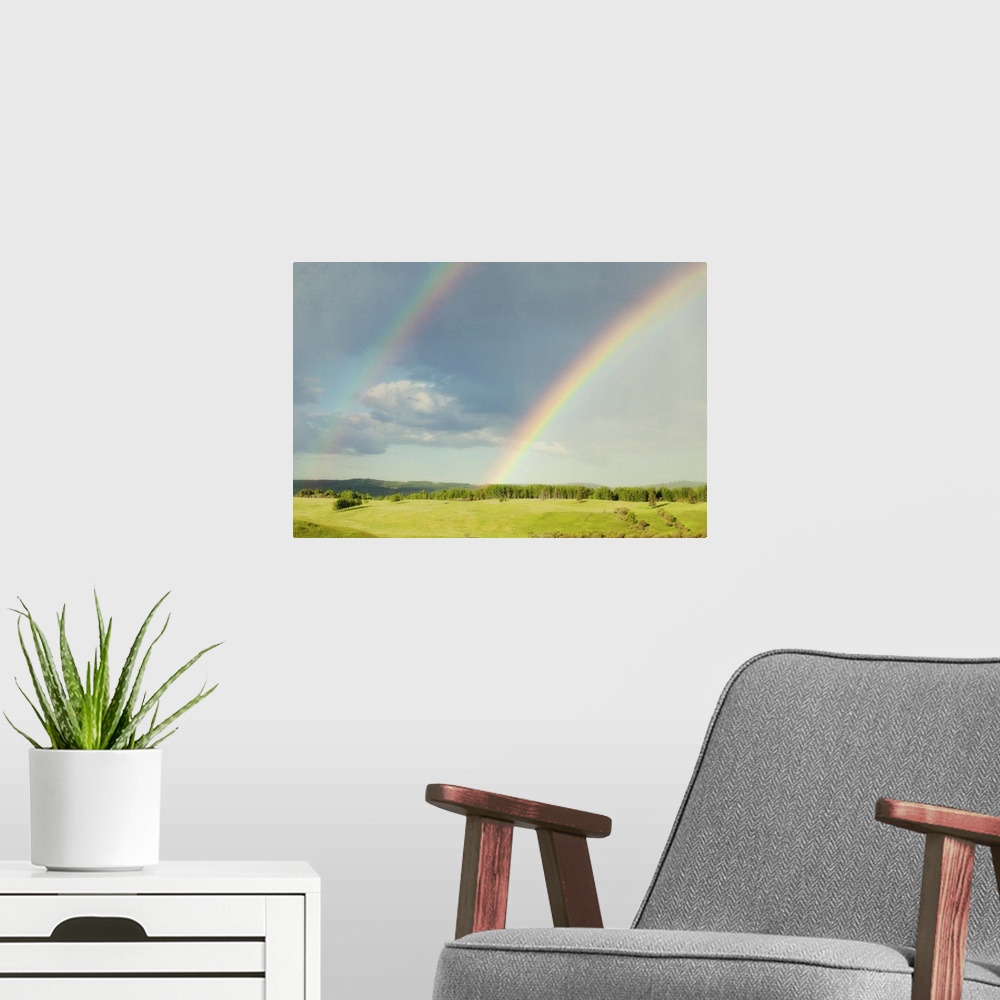 A modern room featuring Photograph of a lush green landscape with a double rainbow overhead.