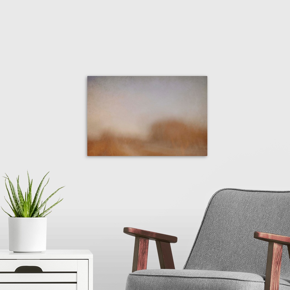A modern room featuring An impressionist abstract photo of trees along a country lane.