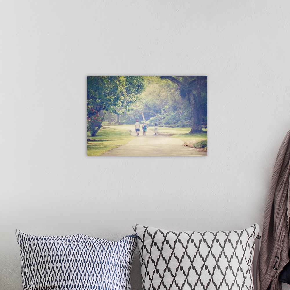 A bohemian room featuring Pictorialist photo of people walking along a path in the rain.