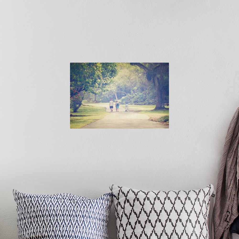 A bohemian room featuring Pictorialist photo of people walking along a path in the rain.