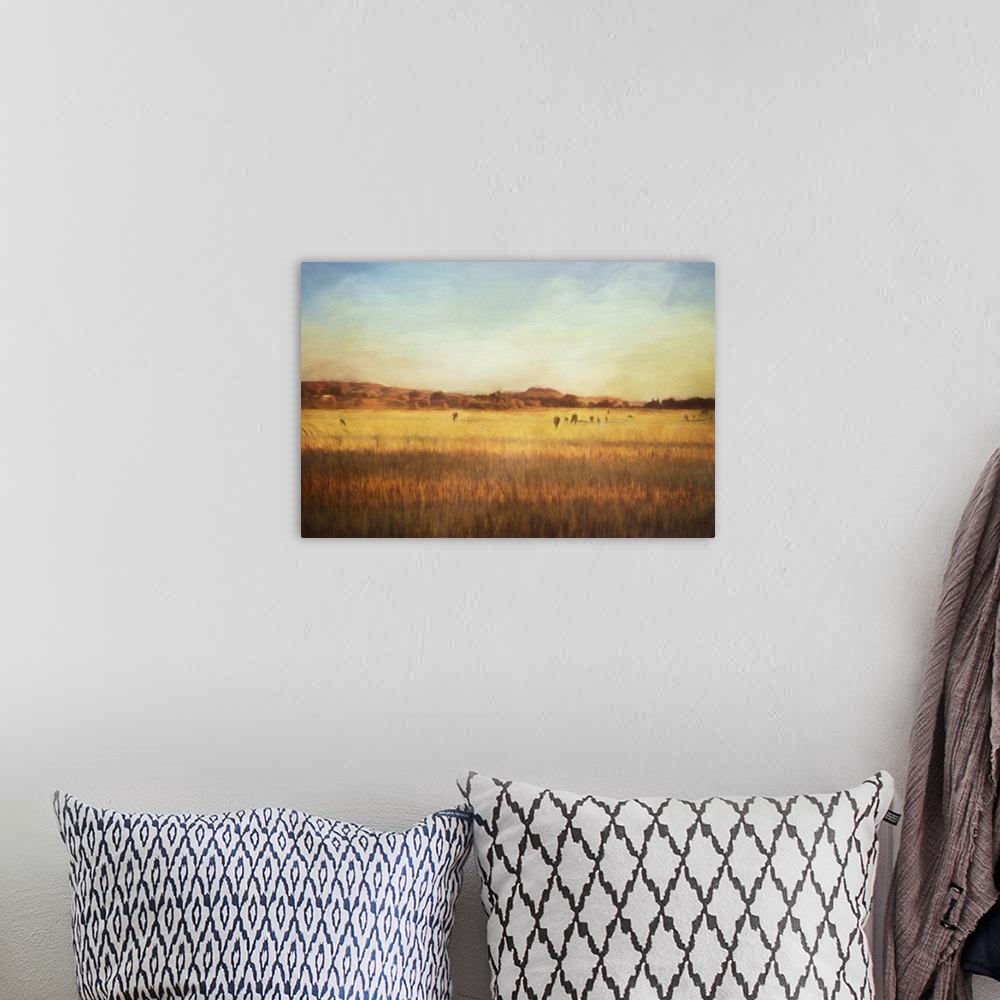 A bohemian room featuring A digital painting of cattle on pasture at sunset.