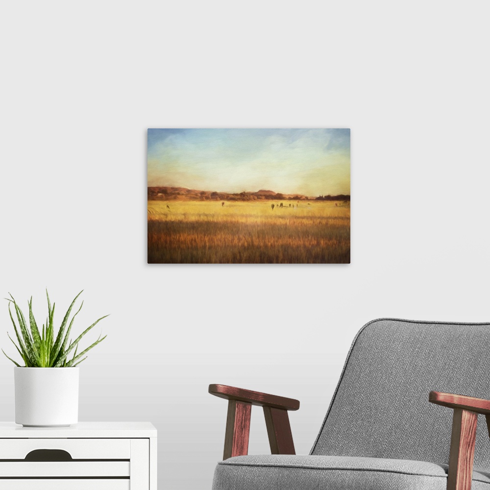 A modern room featuring A digital painting of cattle on pasture at sunset.
