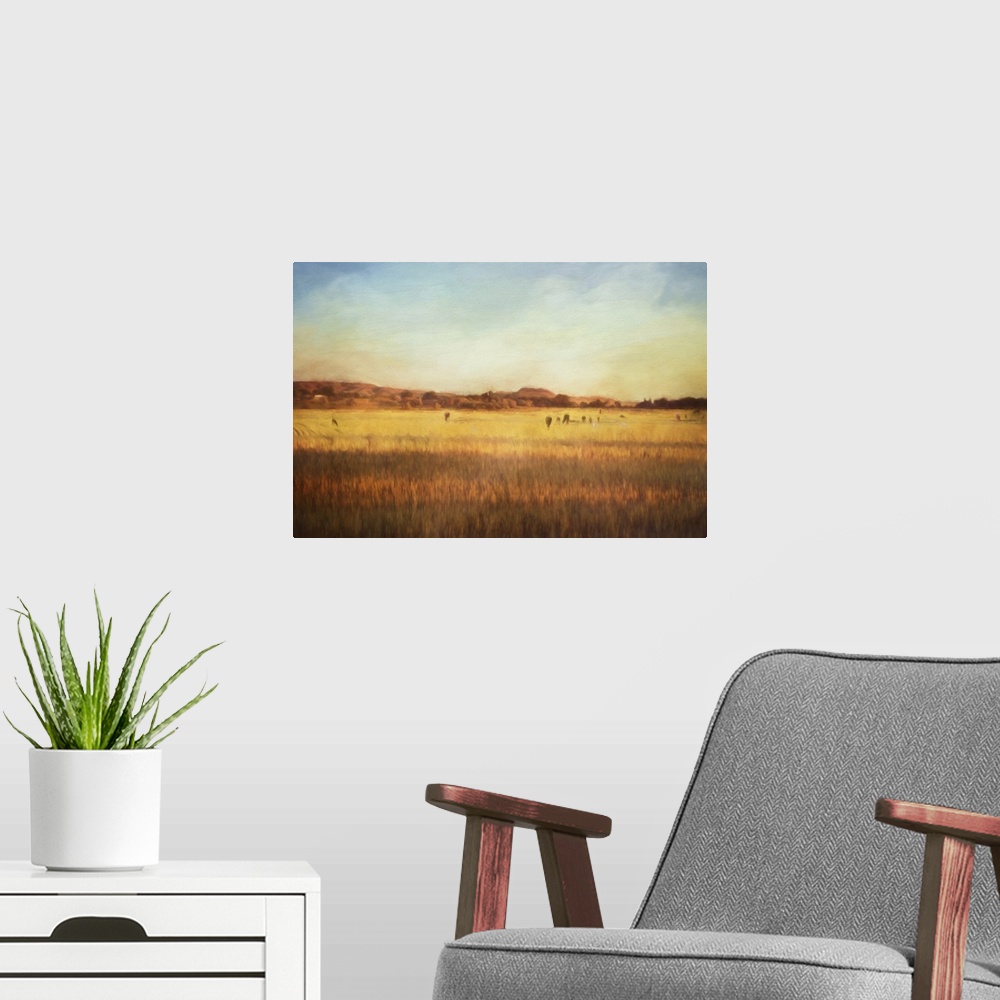 A modern room featuring A digital painting of cattle on pasture at sunset.