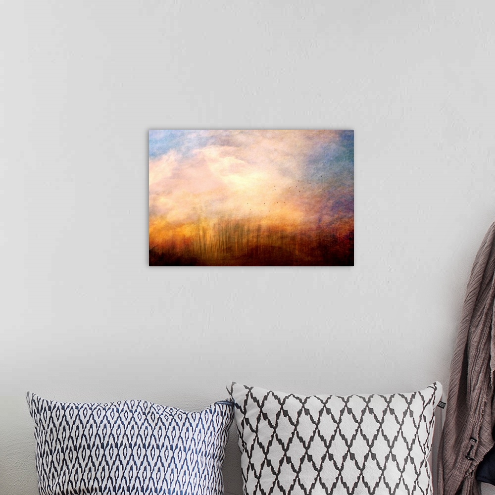 A bohemian room featuring A fine art photograph of a cloud plume dominating the sky as distant birds fly up out of the gras...