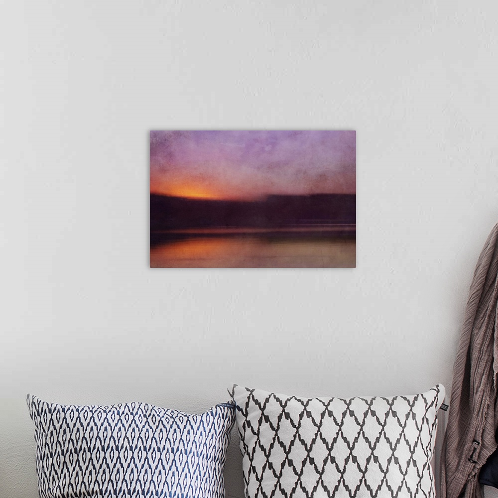 A bohemian room featuring Photograph of a cove surrounded by silhouetted land forms with a sunset illuminating the sky in p...