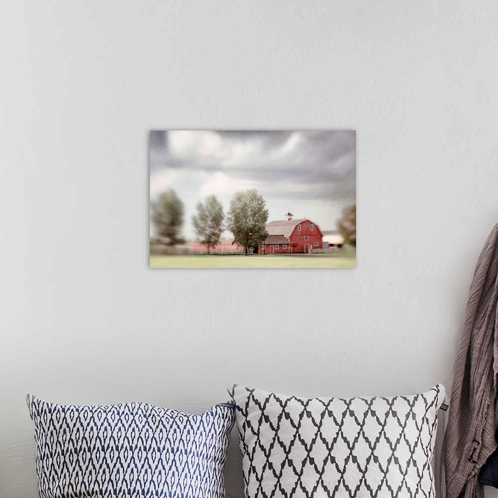 A bohemian room featuring Pictorialist photo of a big red horse barn on a Canadian farm.