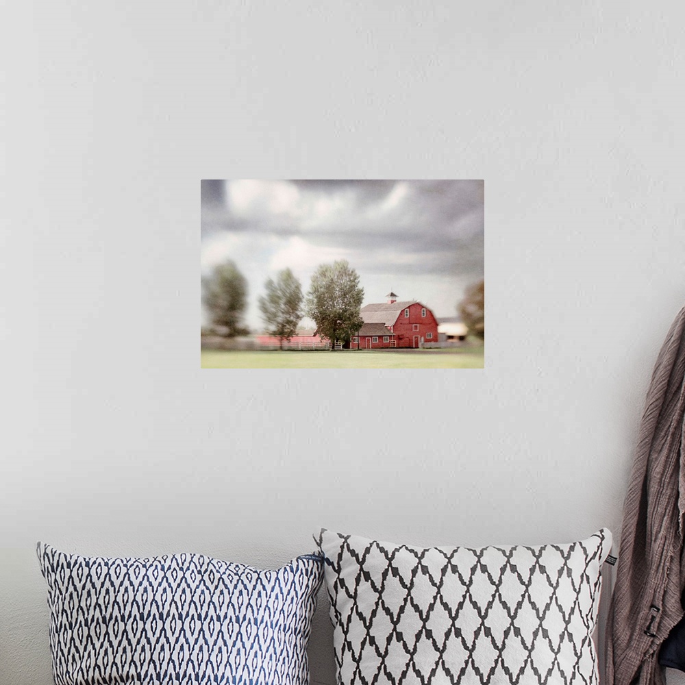 A bohemian room featuring Pictorialist photo of a big red horse barn on a Canadian farm.
