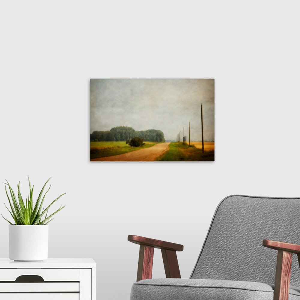 A modern room featuring A distressed photo of country landscape with a silo in the background.