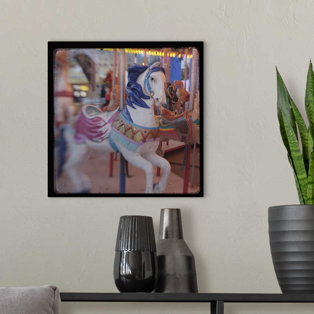 A modern room featuring Square image of a horse on a carousal with a blurred focus.